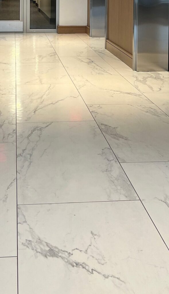 Modern tile showroom display with illuminated sample panels